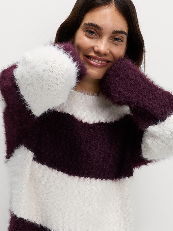 Woman wearing a striped crew-neck jumper