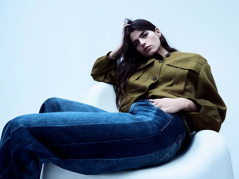 Woman wearing a utility jacket and wide-leg jeans