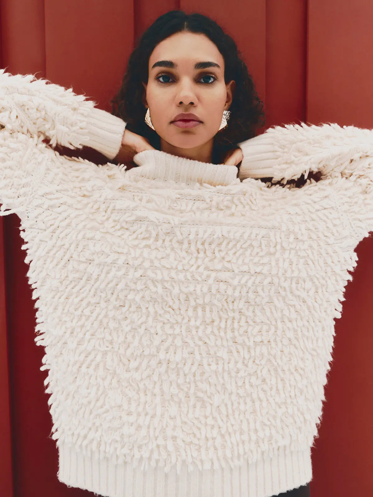 Woman wearing cream textured jumper