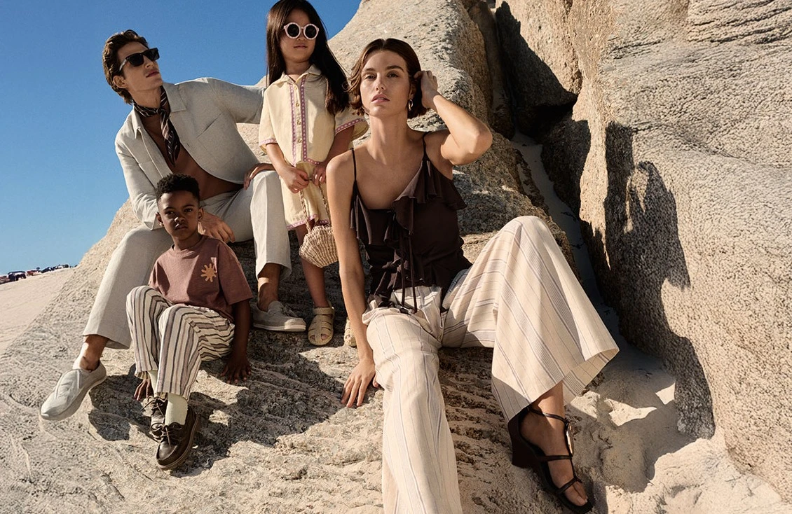 Man, woman and children wearing M&S summer clothes