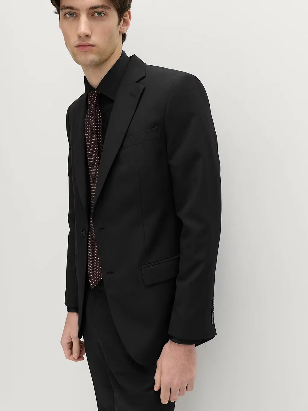 Man in all black suit