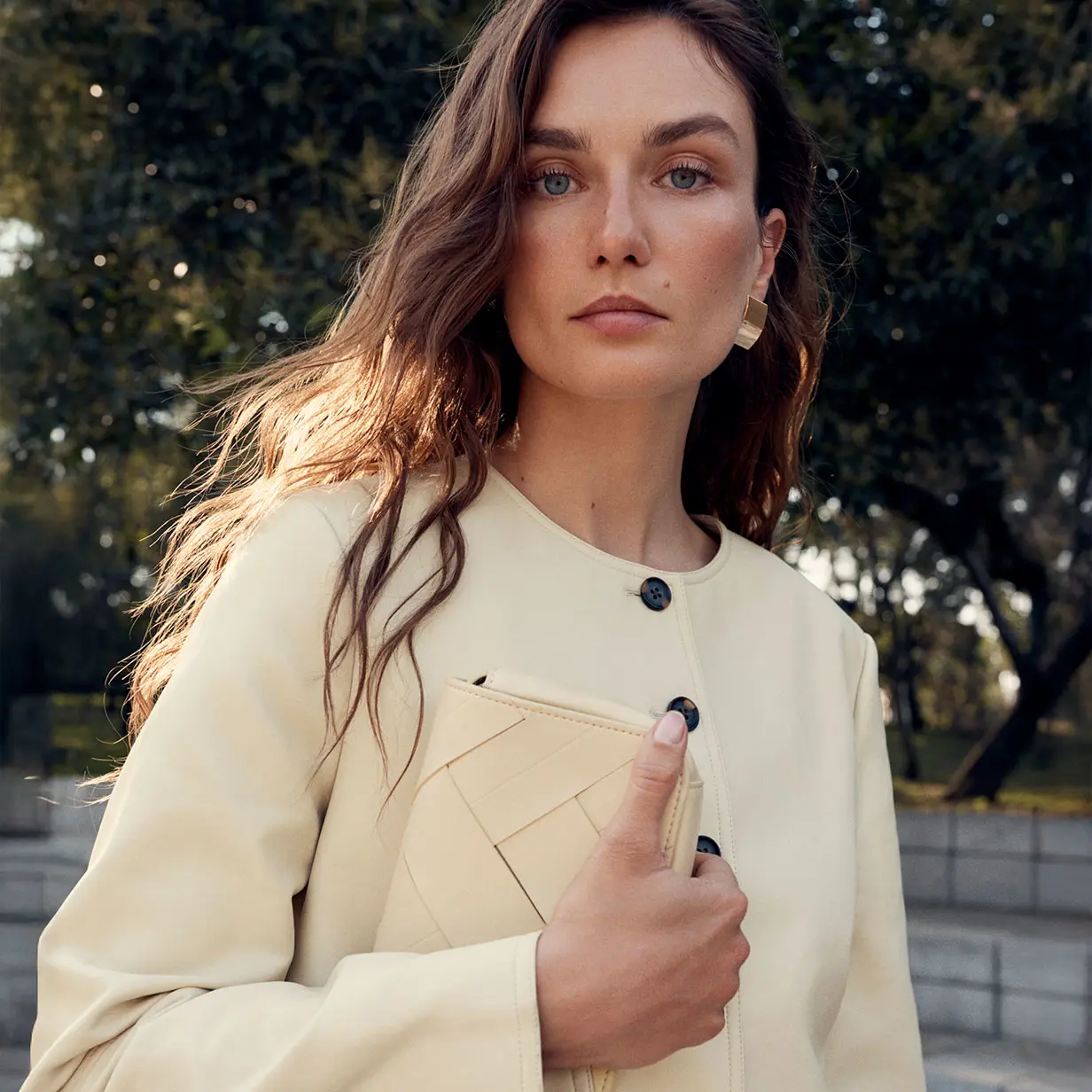 Woman wearing pale yellow faux leather jacket
