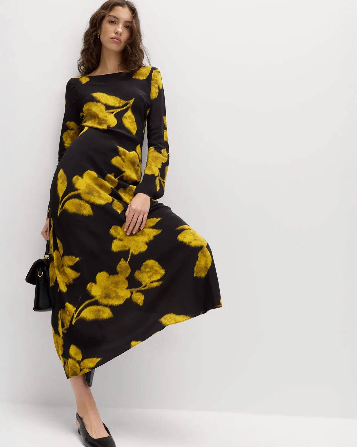 Woman wearing black and yellow floral dress