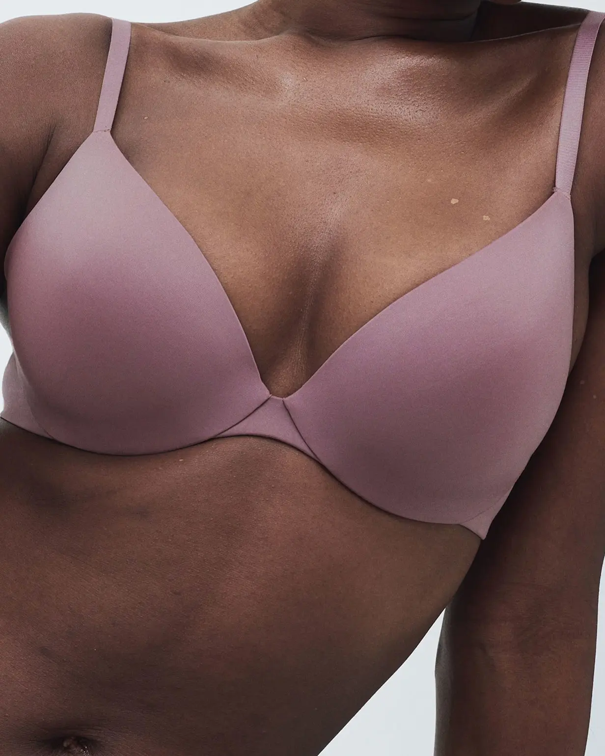 Woman wearing pink T-shirt bra