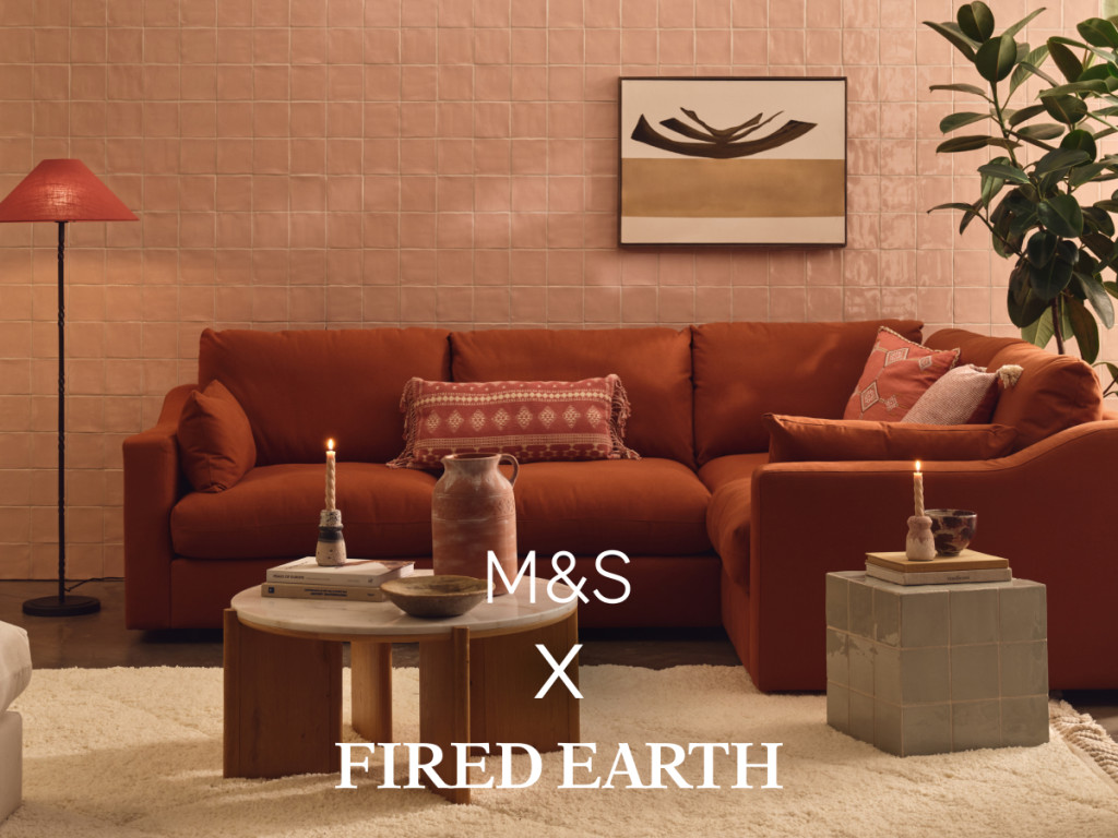 Pale pink living room with a rust-coloured sofa and neutral coffee table. Shop M&S X Fired Earth