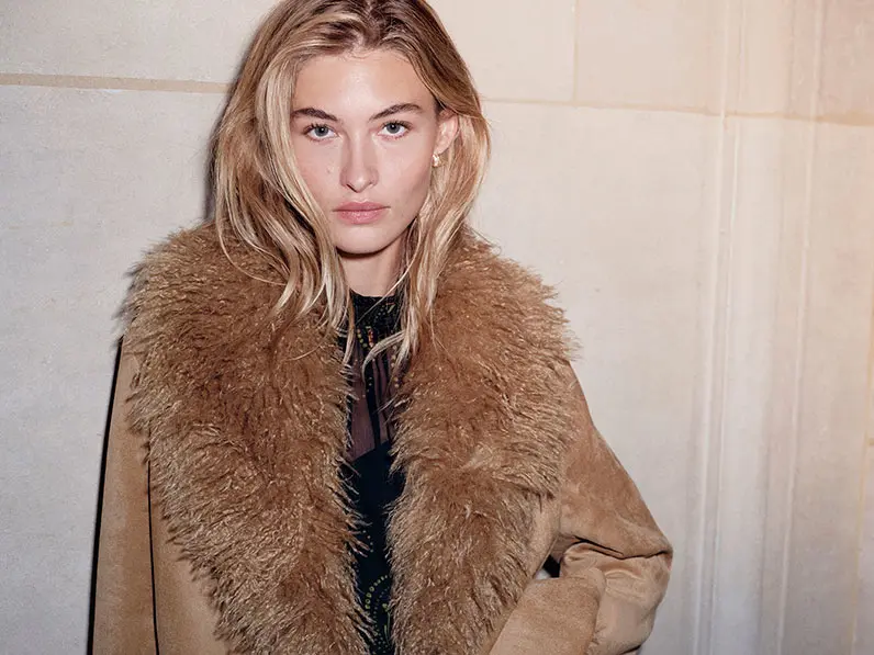 Woman wearing faux fur jacket