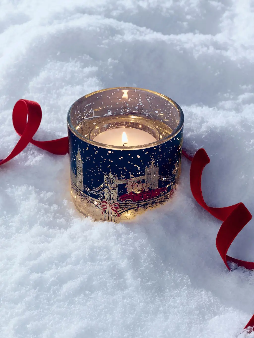 Light-up candle with festive design