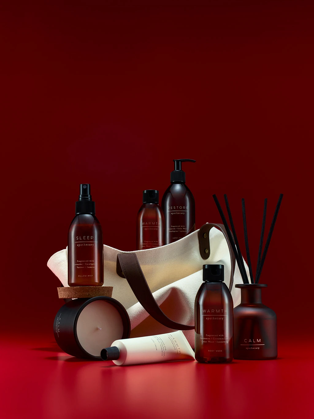 Group of beauty and wellness M&S products, including hand cream, soap, candles and diffusers.
