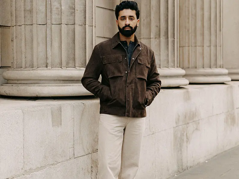 Gurj Sohanpal in brown jacket and tan trousers