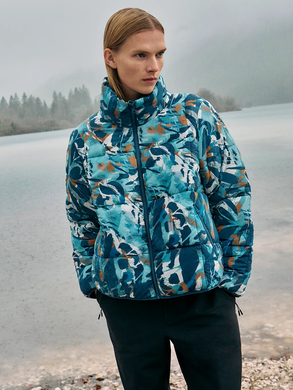 Woman wearing blue patterned padded jacket 