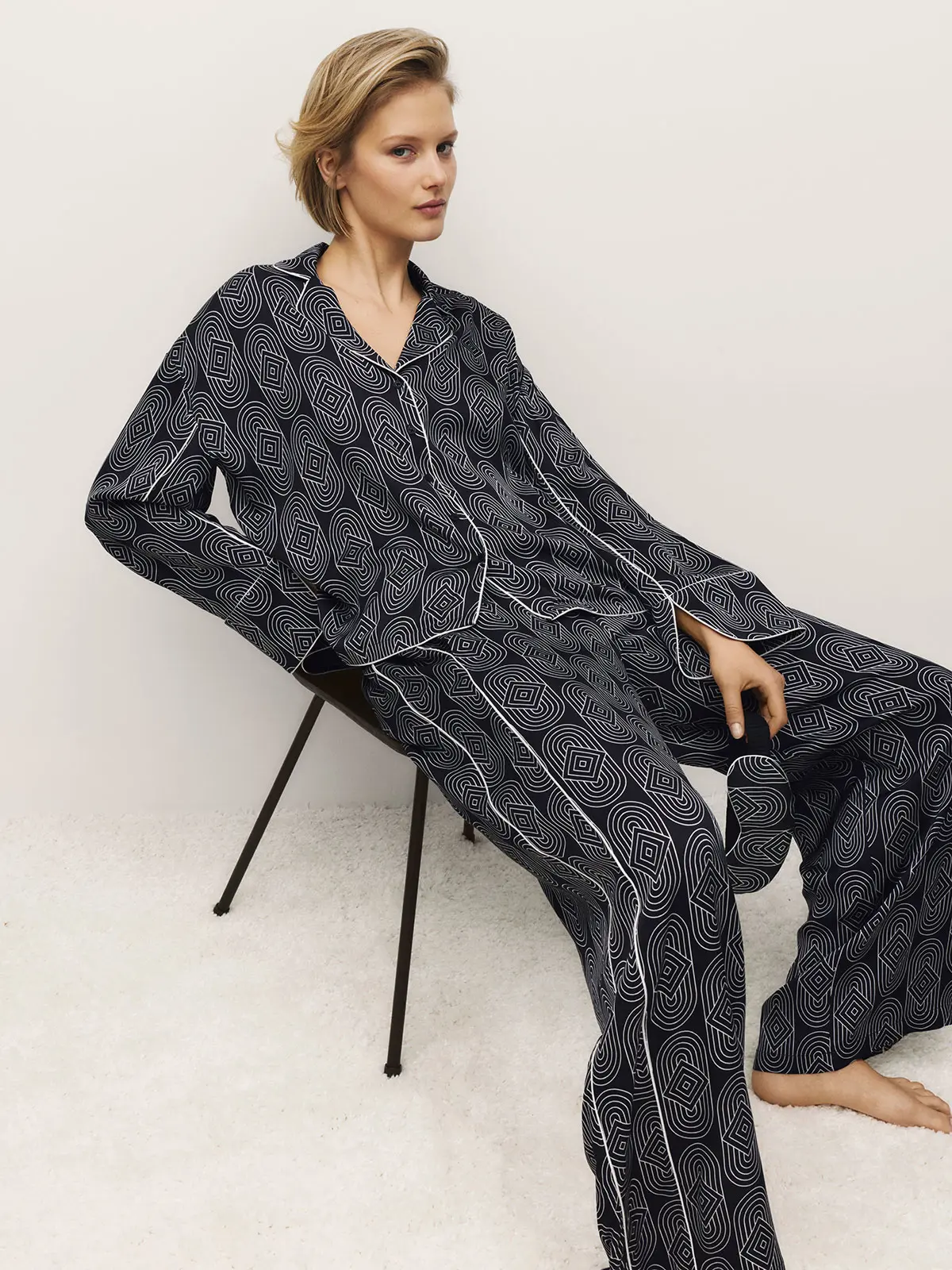 Woman wearing navy printed pyjama set 