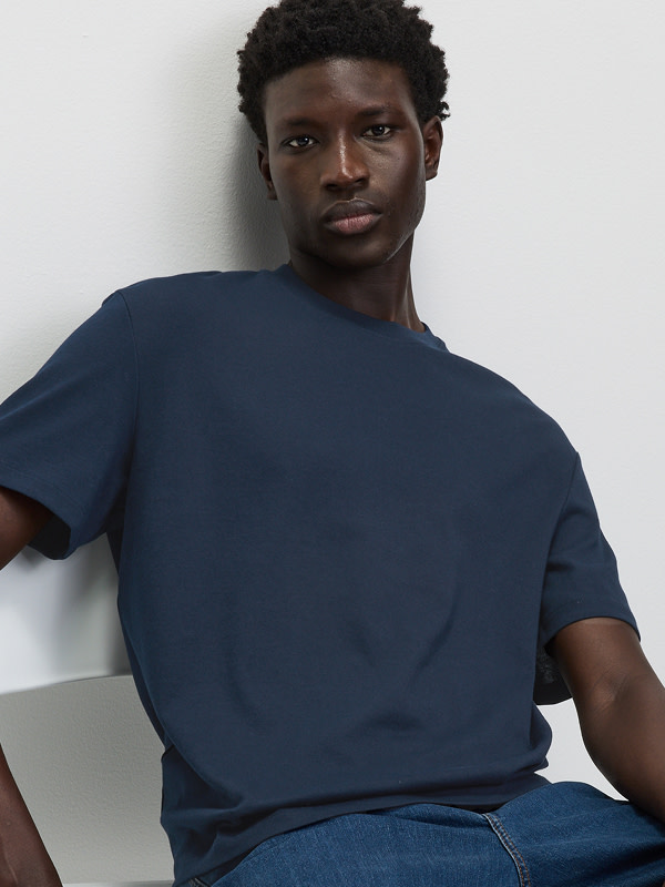 Man wearing blue t-shirt