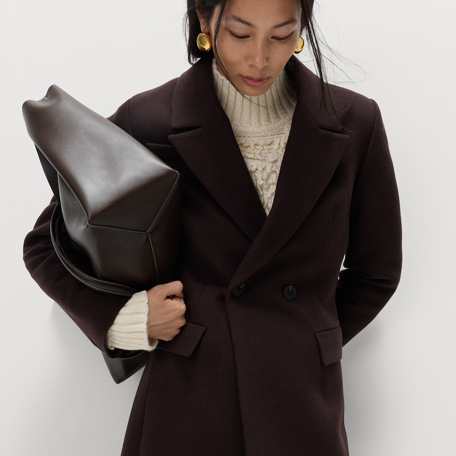 Woman wearing brown coat