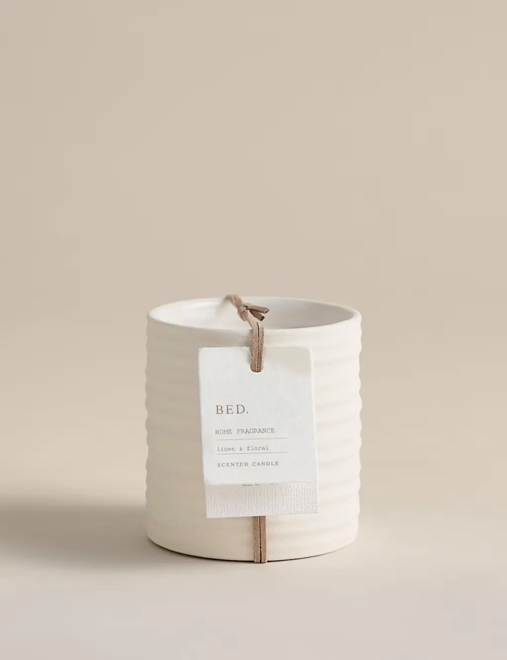 White candle with label