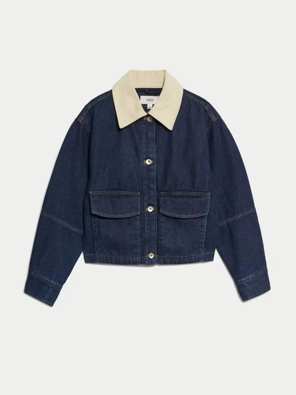A cut out of jacket with a contrasting collar on a cream background