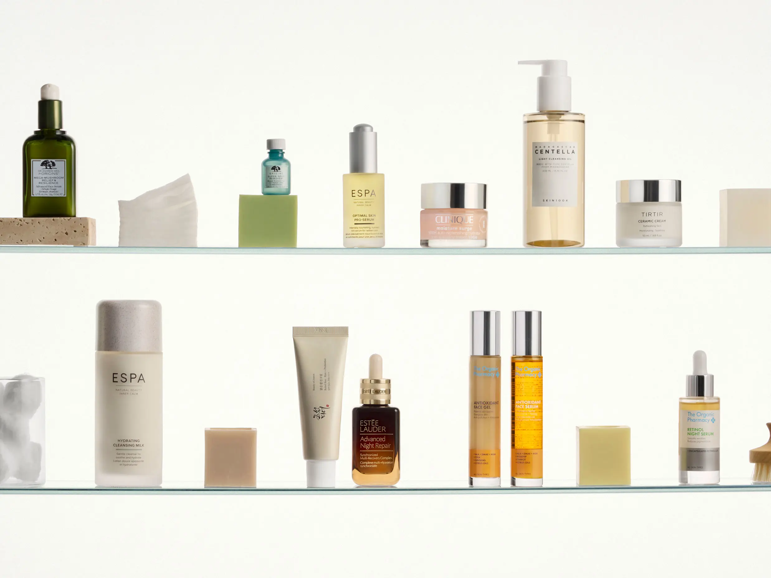 Skincare products on glass shelves