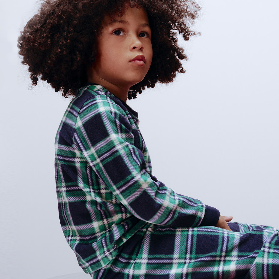 Boy wearing checked pyjamas
