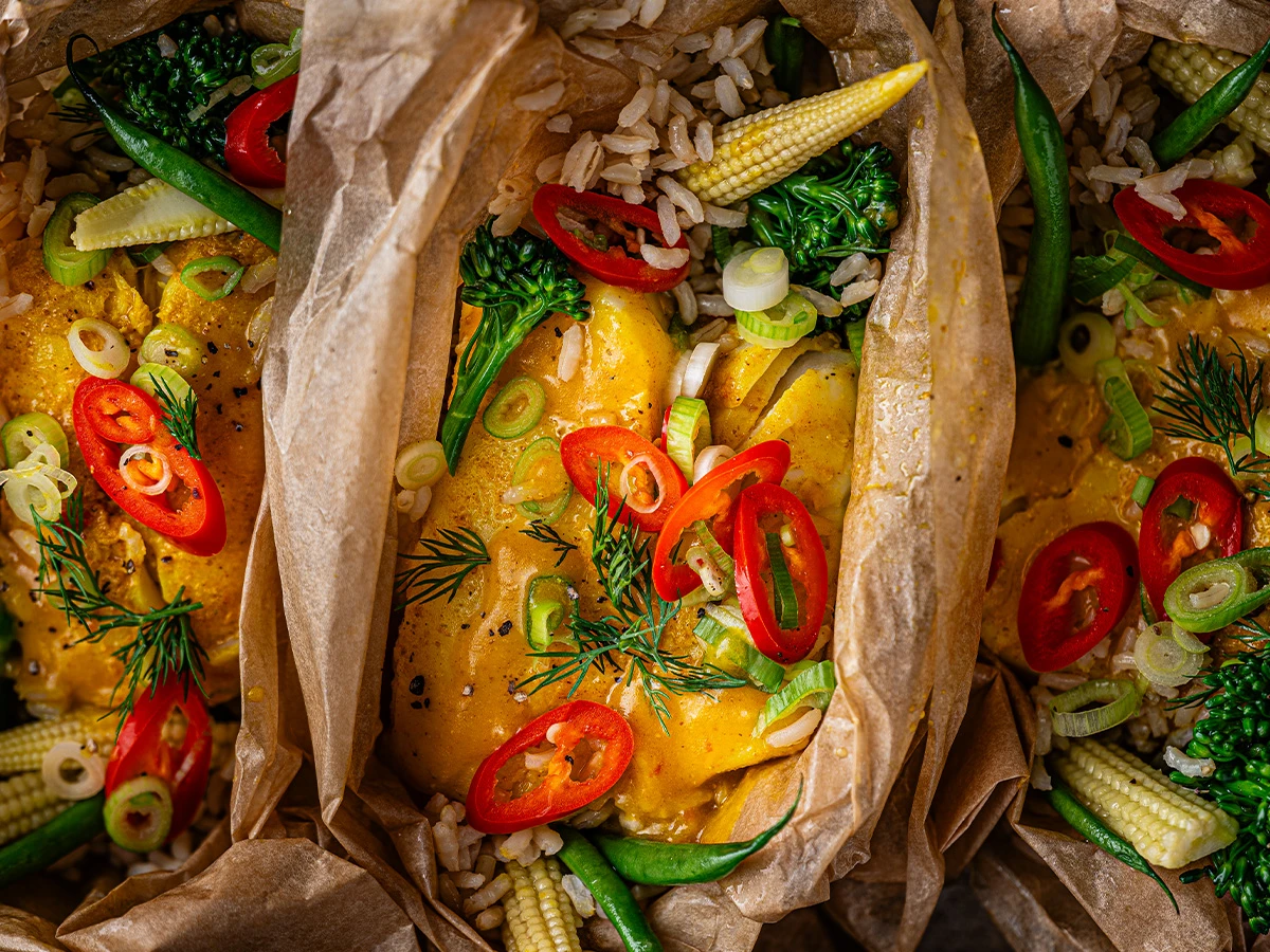 Fish with veggies in parchment parcel