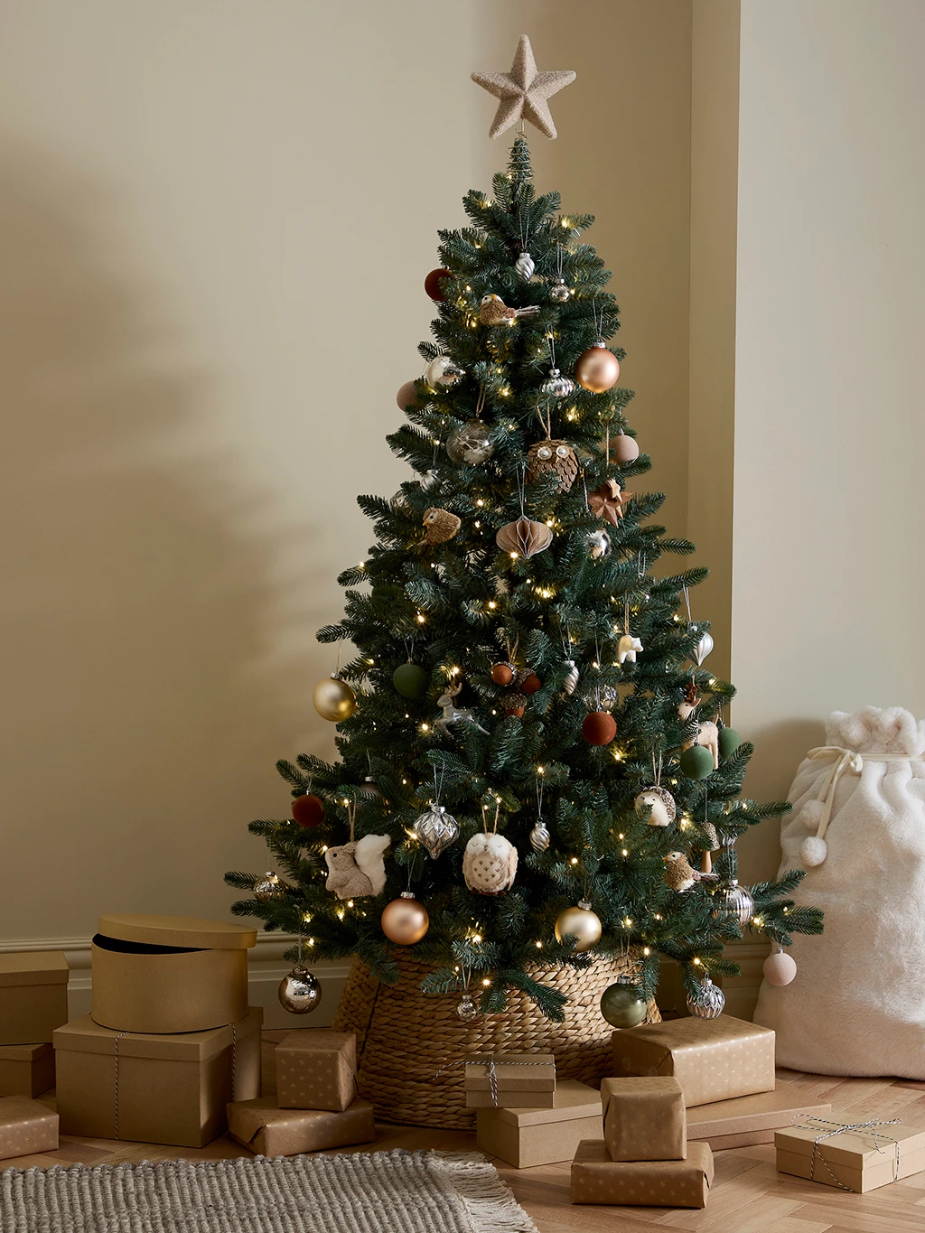 Spruce-shaped Christmas tree with rustic neutral decorations
