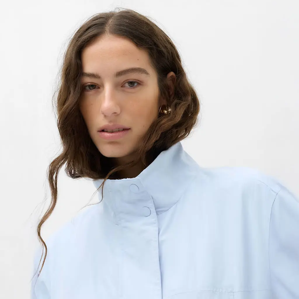 Woman wearing a blue bomber jacket