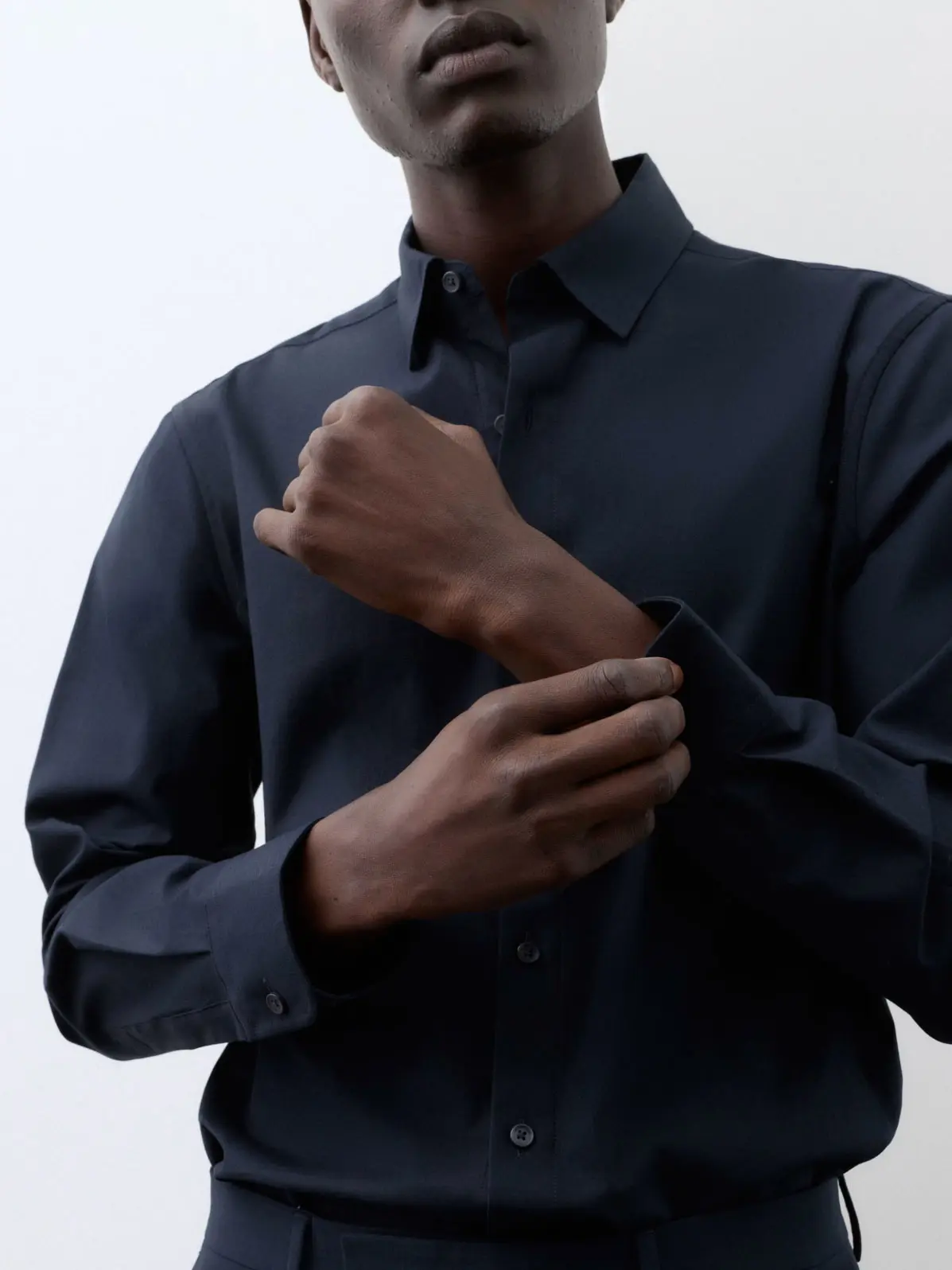 Man wearing dark navy shirt 