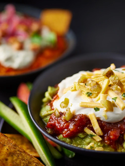 Bowl of layered Mexican dip