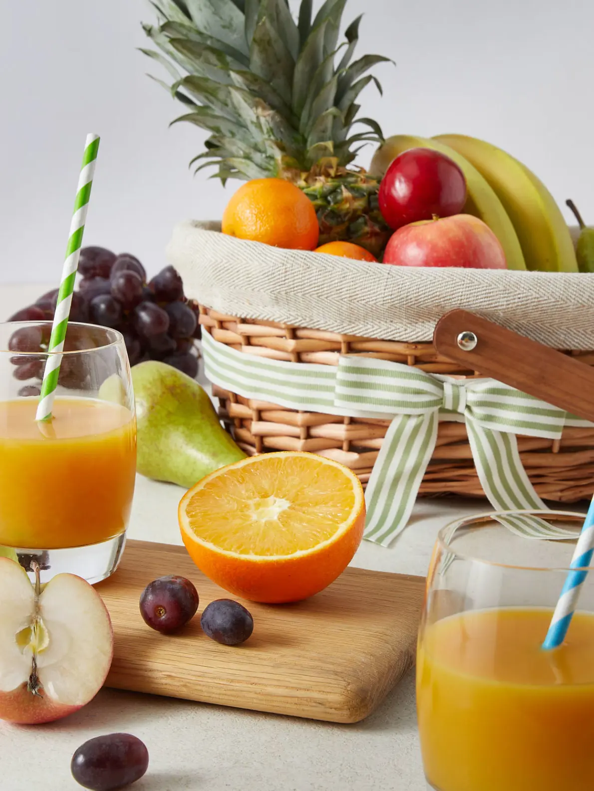 Assortment of fruits including oranges, apples, pears, grapes and bananas