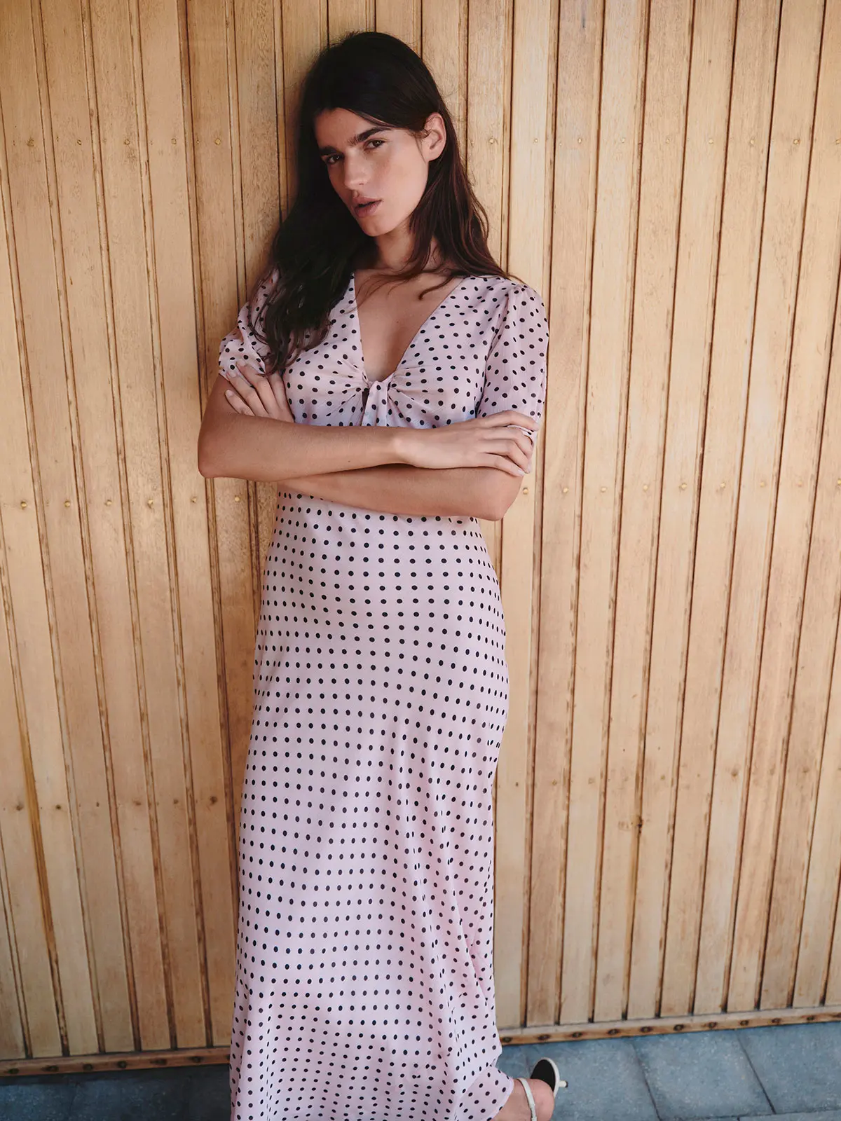 Woman wearing baby pink polka-dot dress