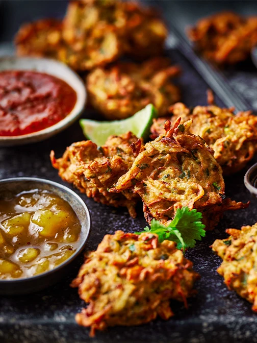 Veggie pakoras with bowl of chutney