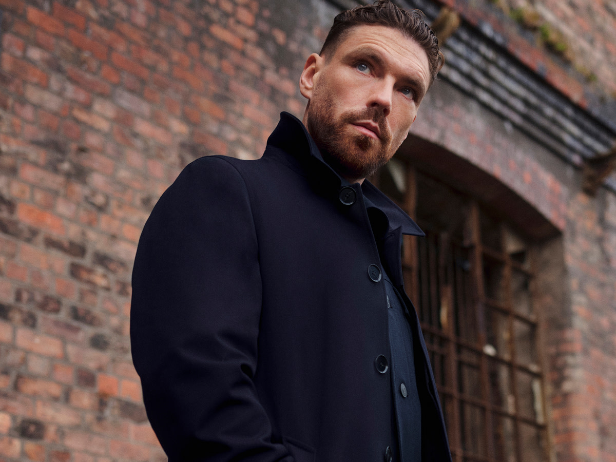 James Nelson Joyce wearing black jacket for M&S