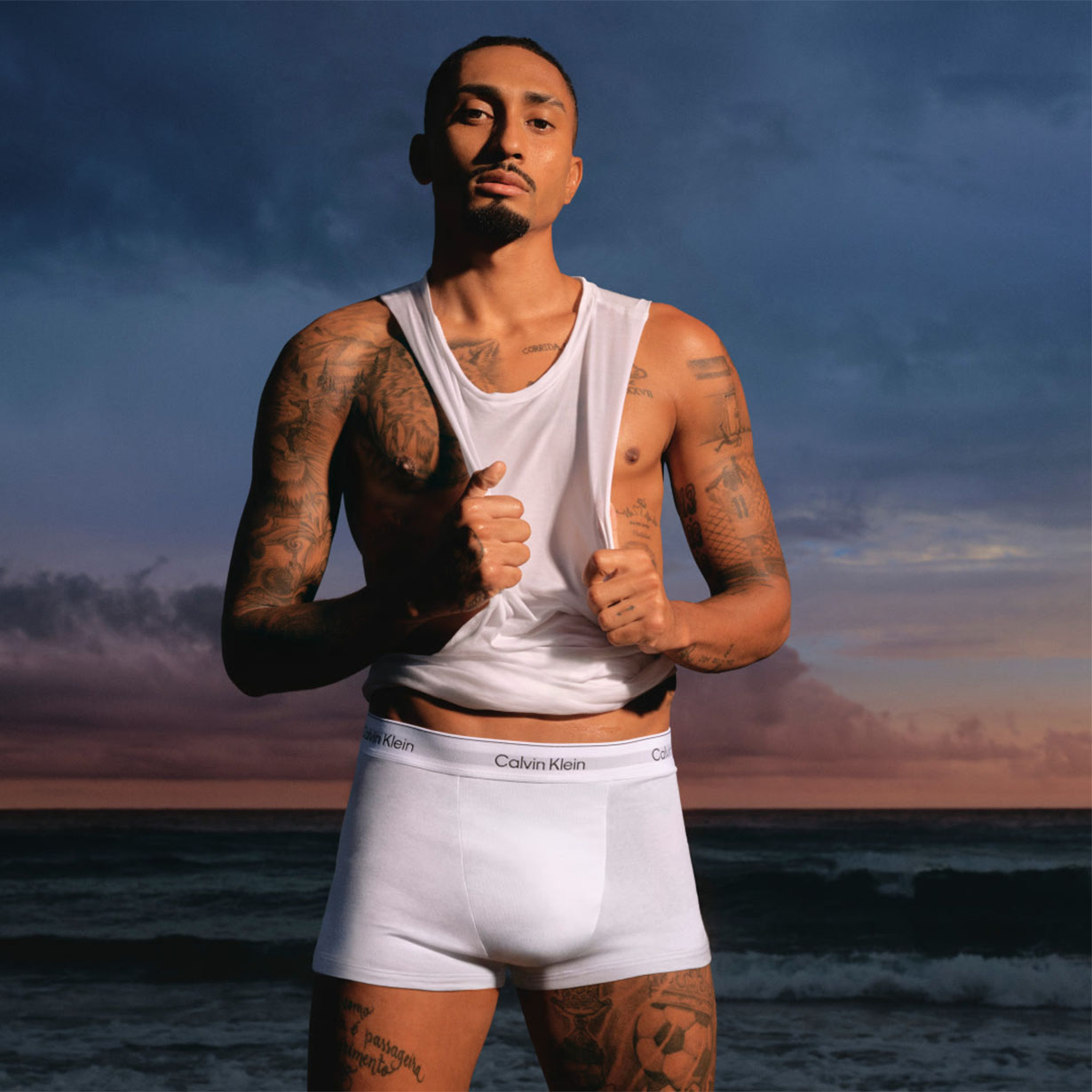 man wearing white vest and boxers