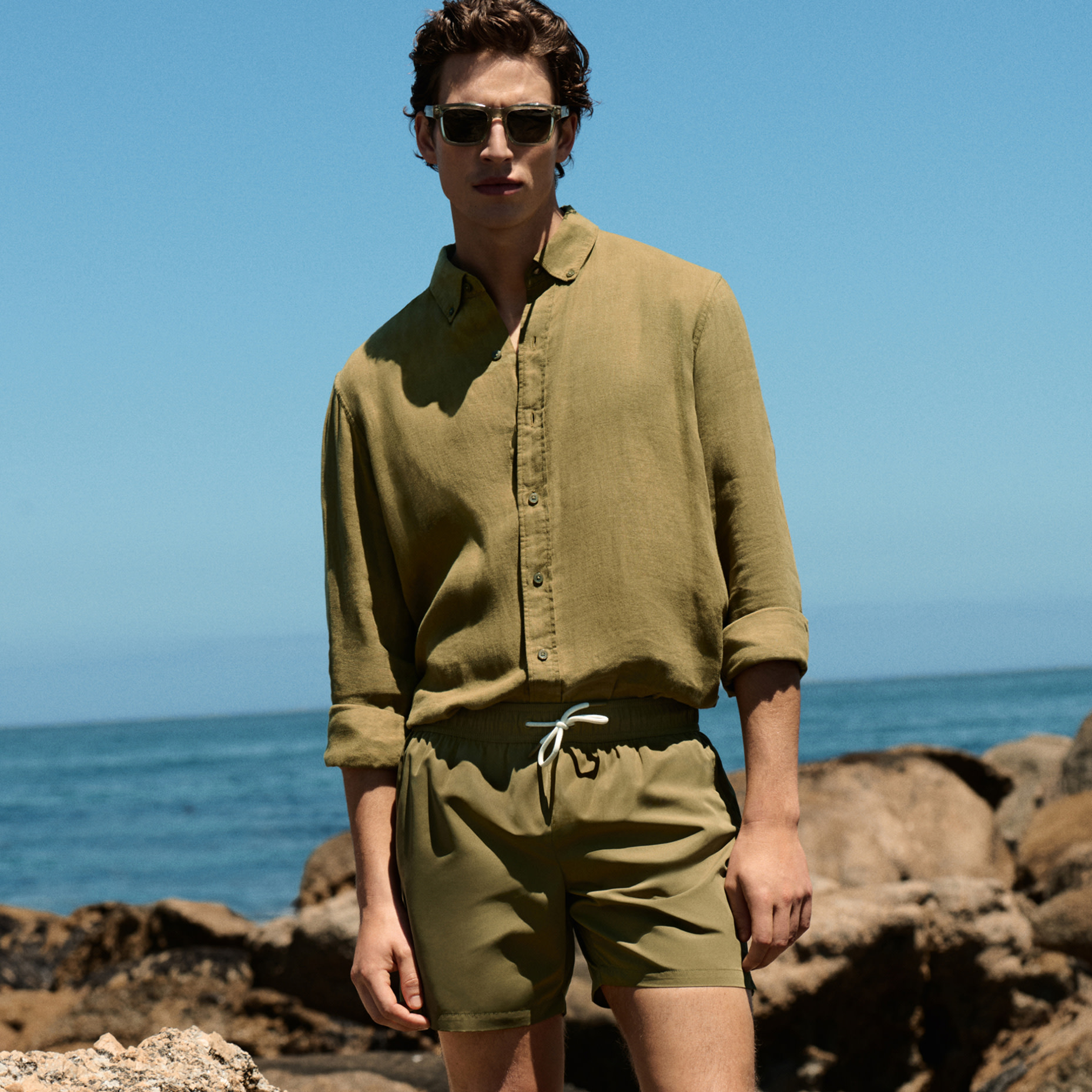 Man wearing green shirt and matching shorts 