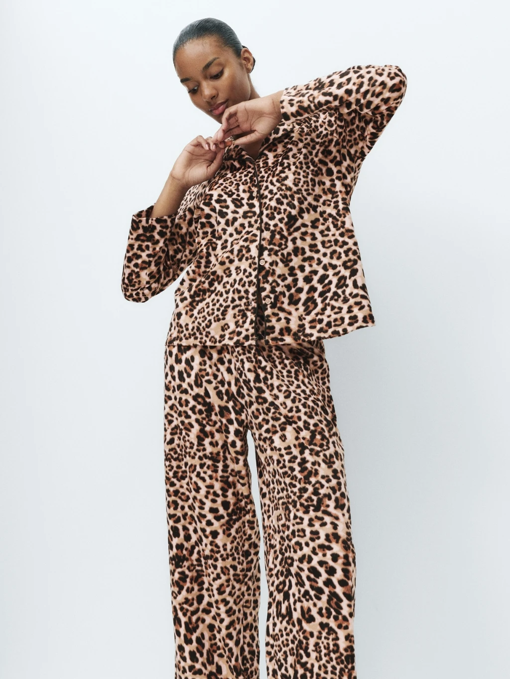 Woman wearing leopard-print pyjamas