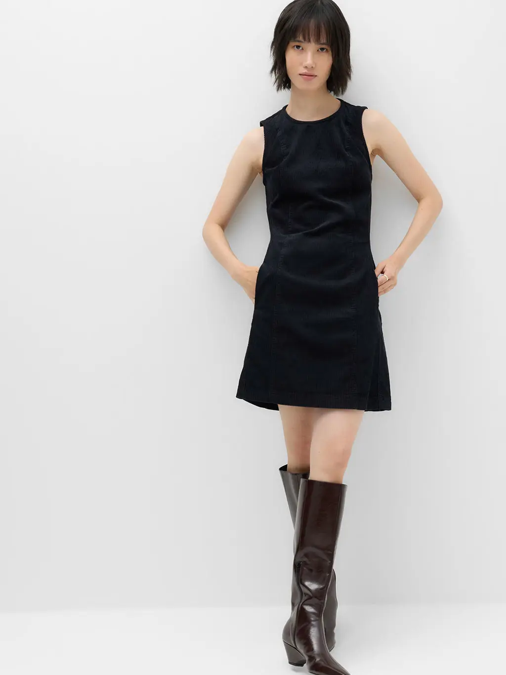Woman in mini dress and boots