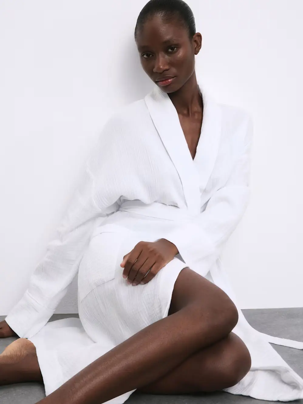 Woman wearing white dressing gown