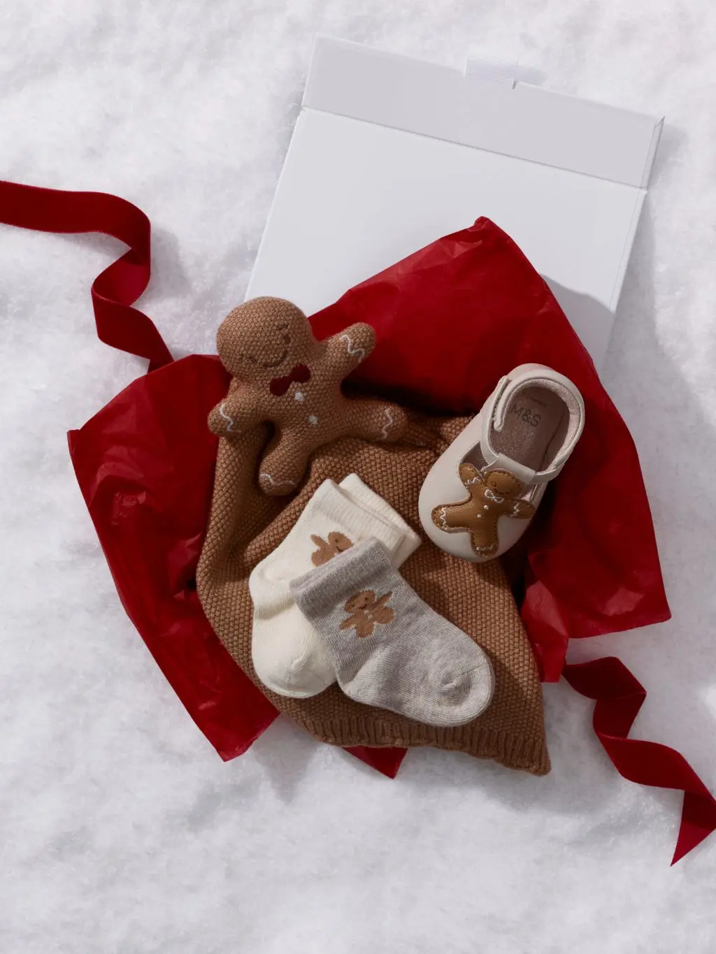An array of Christmas gifts suitable for baby