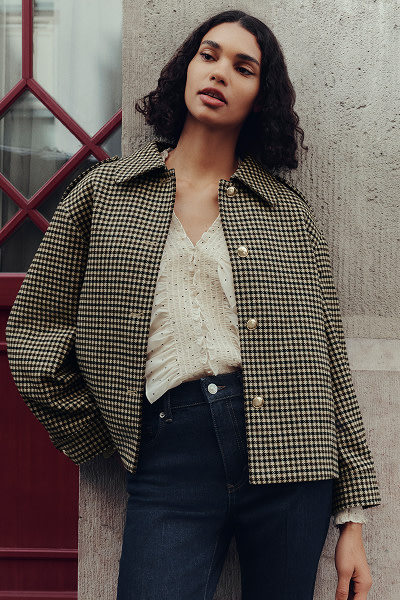 Woman wearing brown printed jacket