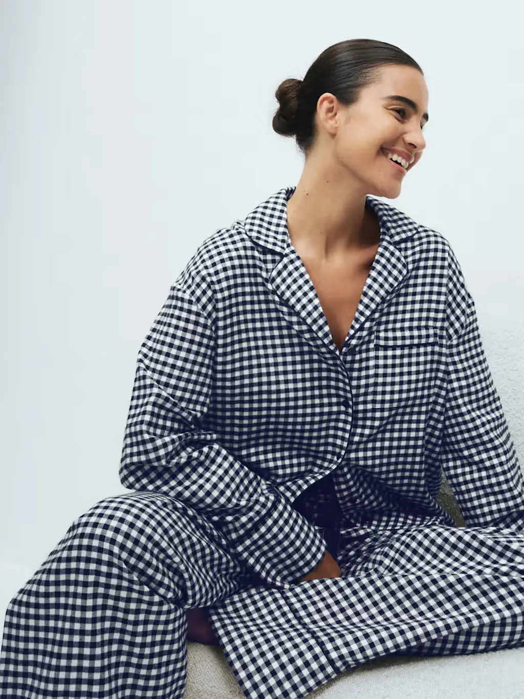 Woman in blue gingham pyjamas