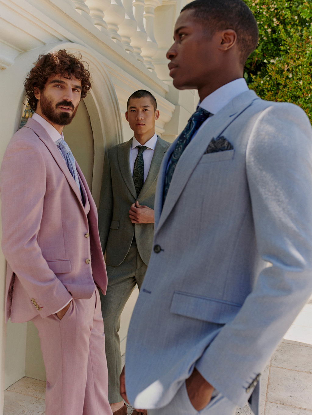 Three men wearing wedding suits. Read wedding suits for grooms and guests