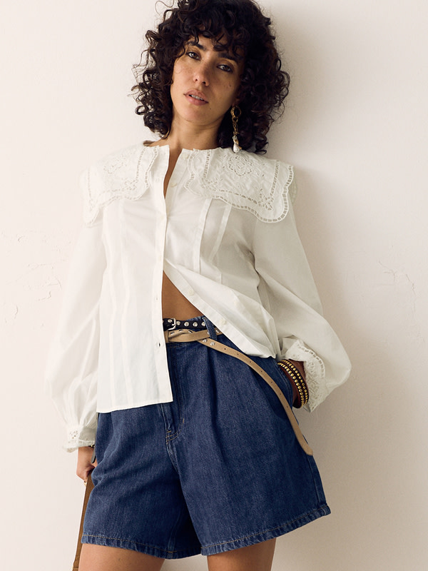 Woman in white top and shorts