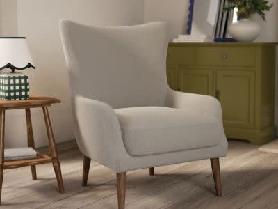 Image of a white armchair. Shop armchairs