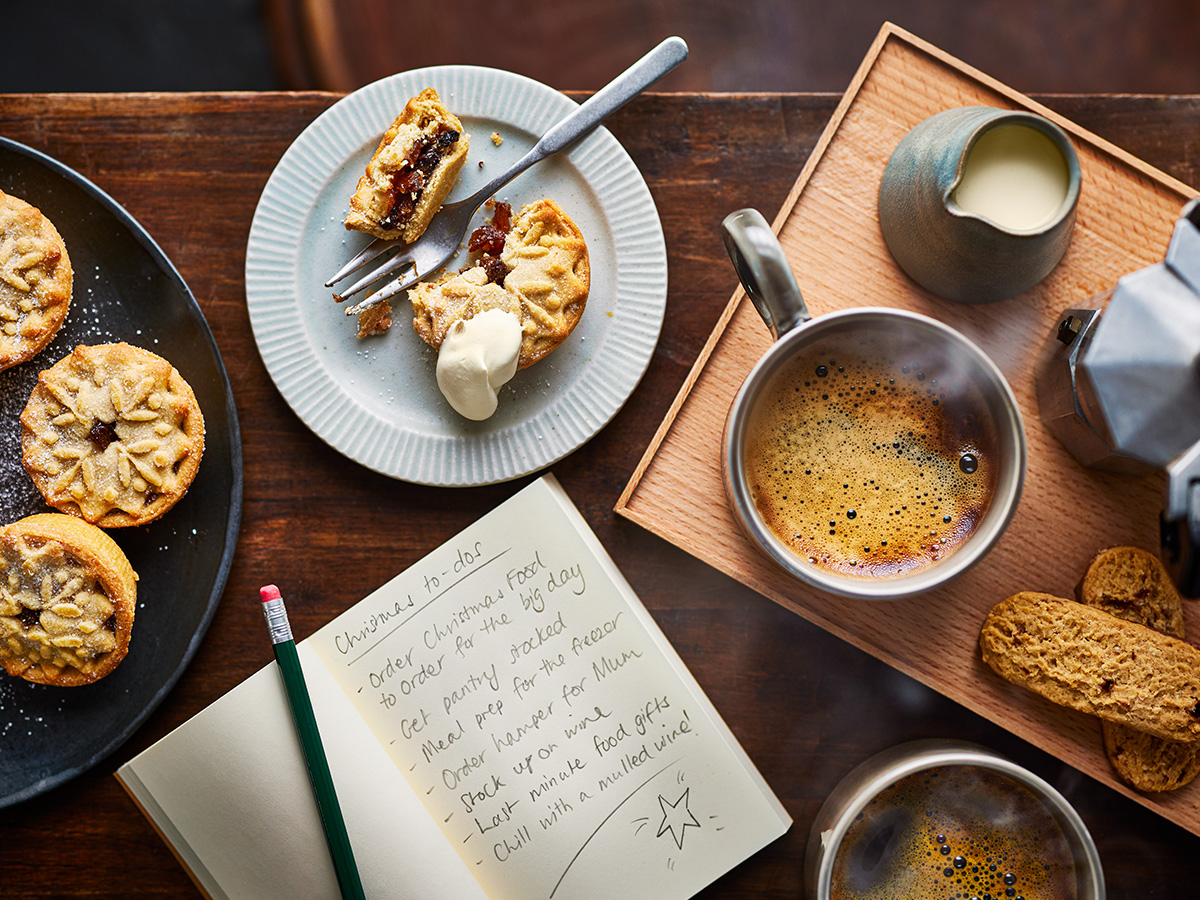 A table set with a mince pie and coffee