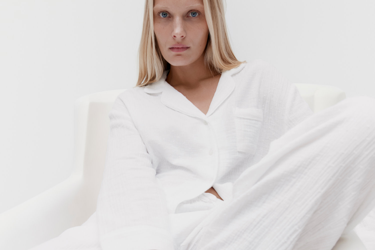 Woman wearing white cotton pyjamas