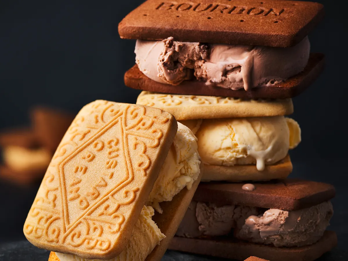 Custard cream and bourbon ice cream sandwiches in a stack