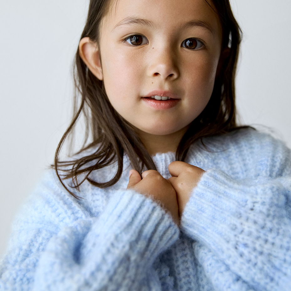 Girl wearing blue jumper