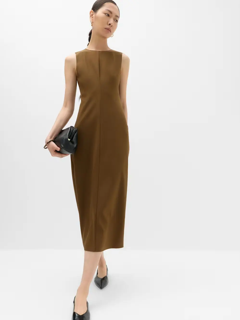 Woman in green midi dress