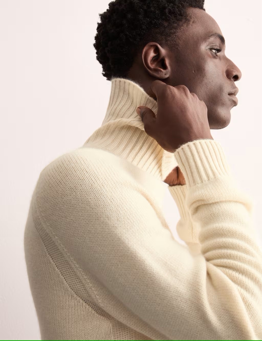 Man wearing cream roll neck cashmere jumper by Jaeger at M&S