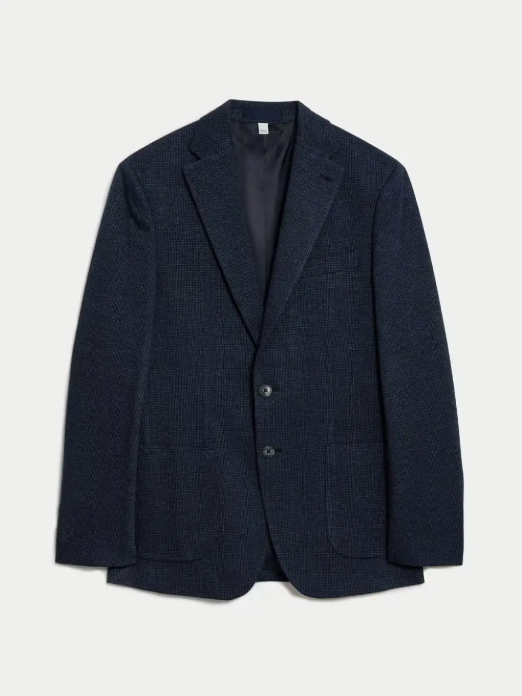 A cut out of a check navy blazer shot against a light background
