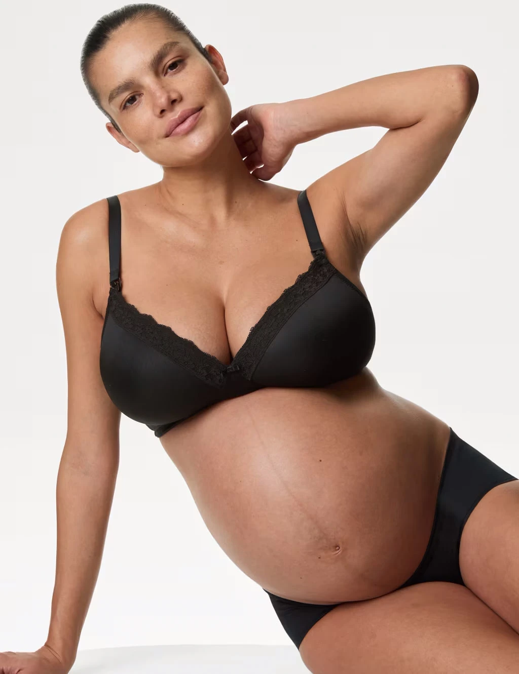 Woman wearing black maternity bra and knickers