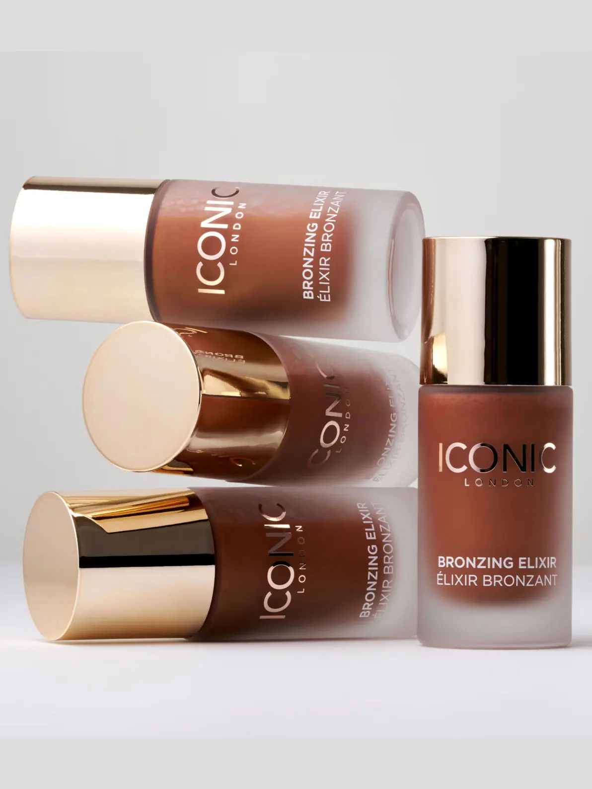 Image of 4 bottles of bronzing beauty product